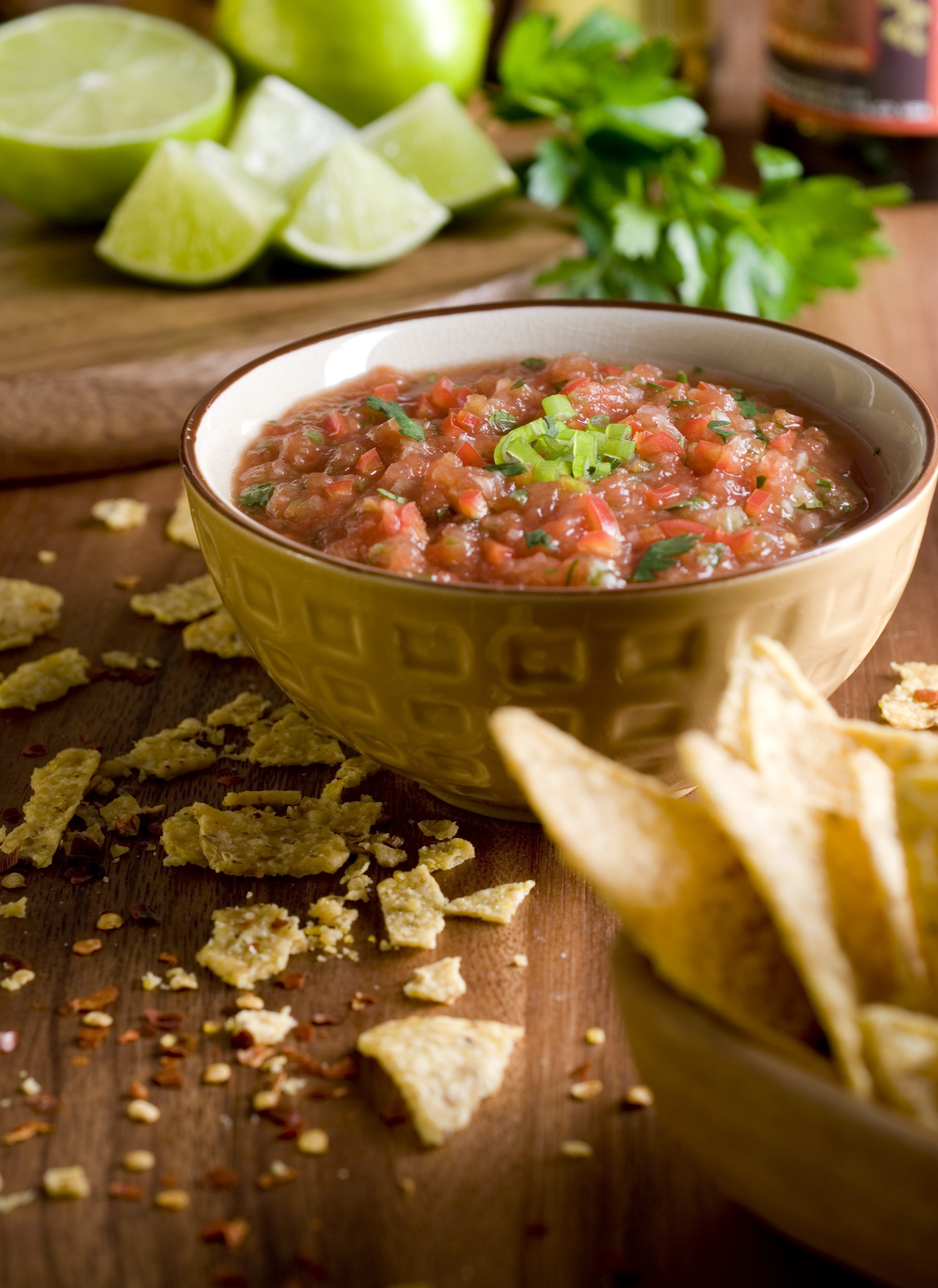 salsa and corn chips in a rustic setting.